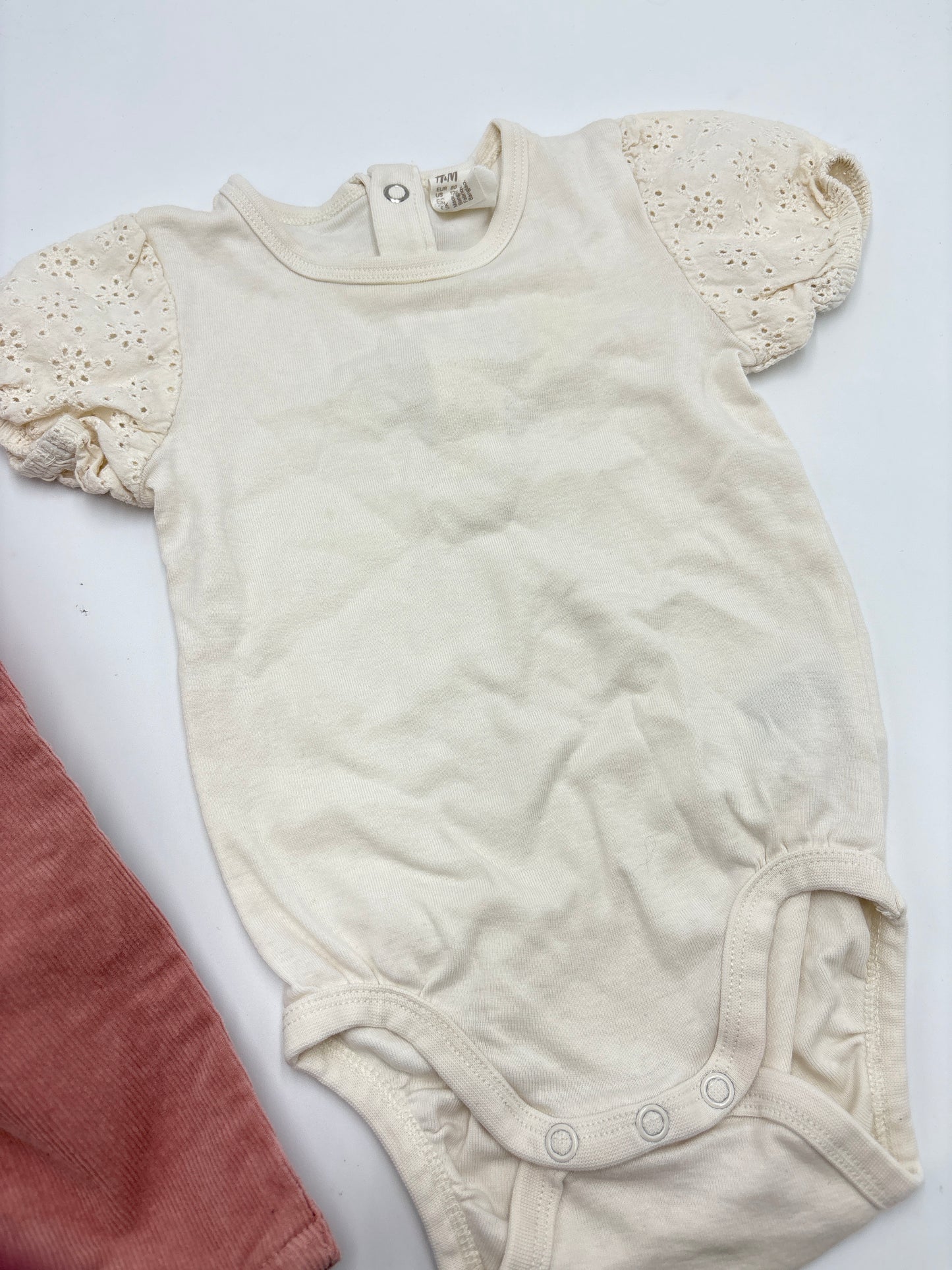 Cache-couche 9-12m fait grand